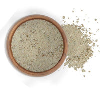 French Citrus Fennel Sea Salt 5 Lbs in a wooden bowl with some spilled on the side.