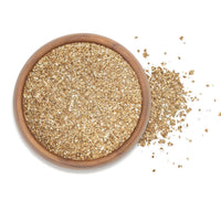 Smoked Hickory Himalayan Sea Salt in a wooden bowl, showcasing fine grain texture and rich flavor.